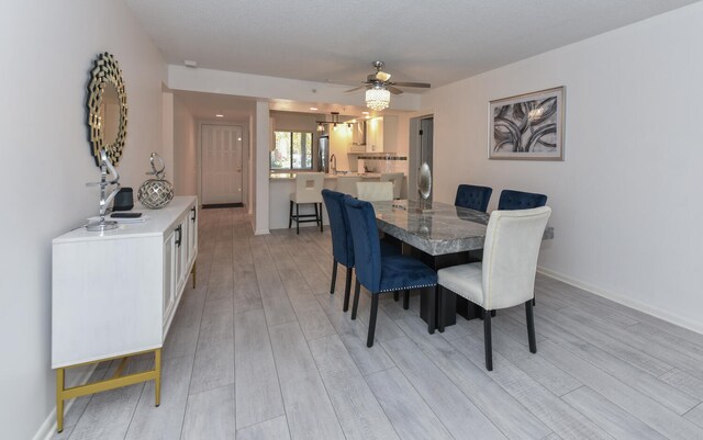 1001 Seafarer Cir Unit 102, Jupiter, FL 33477 - dining space featuring light wood-style flooring, ceiling fan, and baseboards