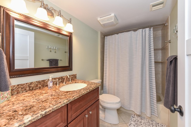 1001 Seafarer Cir Unit 102, Jupiter, FL 33477 - full bathroom featuring tile patterned floors, toilet, vanity, and shower / bath combo with shower curtain