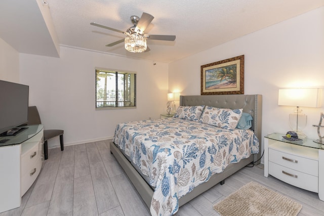 1001 Seafarer Cir Unit 102, Jupiter, FL 33477 - bedroom with light wood-style flooring, baseboards, and a ceiling fan