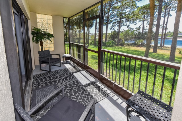 1001 Seafarer Cir Unit 102, Jupiter, FL 33477 - sunroom with a water view and healthy amount of natural light