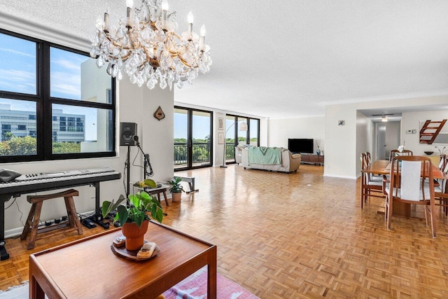 living area with a textured ceiling, crown molding, and baseboards