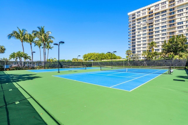 view of sport court with fence