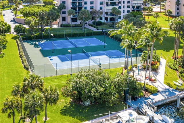 view of sport court featuring fence