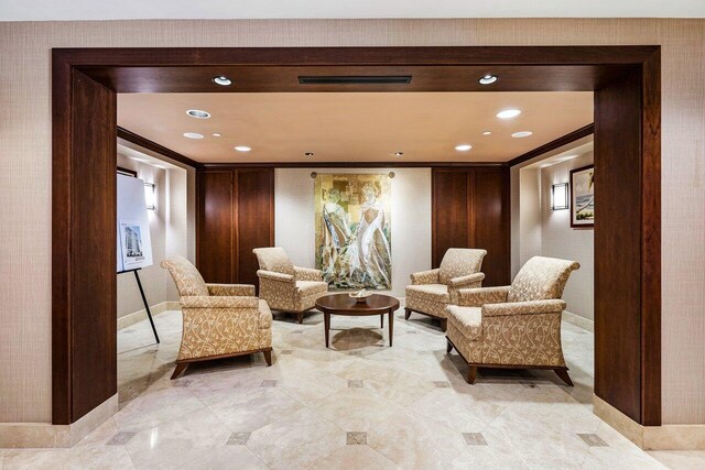 exercise room featuring a paneled ceiling, baseboards, and carpet flooring