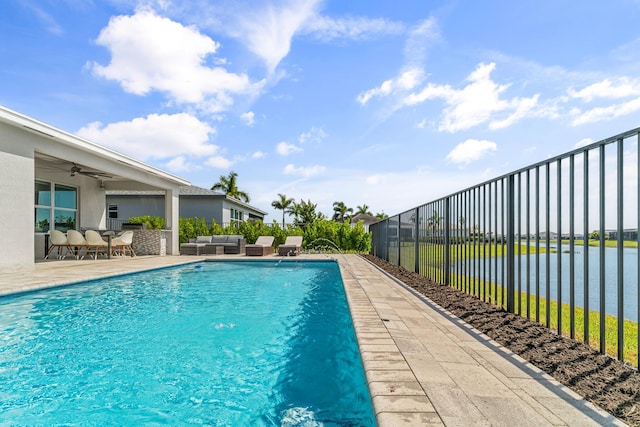 view of swimming pool with ceiling fan, an outdoor hangout area, fence, a fenced in pool, and a patio area