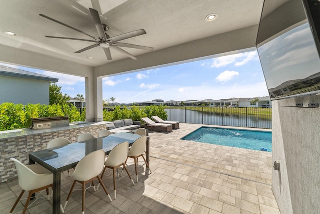 view of pool featuring a fenced in pool, area for grilling, a ceiling fan, a patio area, and a fenced backyard