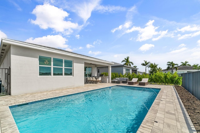 view of pool featuring ceiling fan, a patio, a fenced backyard, an outdoor living space, and a fenced in pool