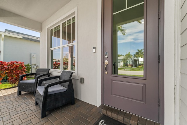 entrance to property featuring a porch