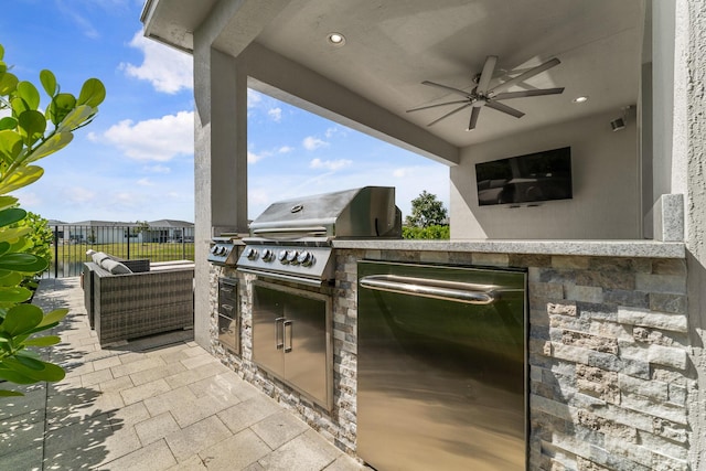 view of patio with ceiling fan, fence, grilling area, and area for grilling