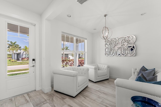 living room featuring a chandelier, recessed lighting, visible vents, and baseboards