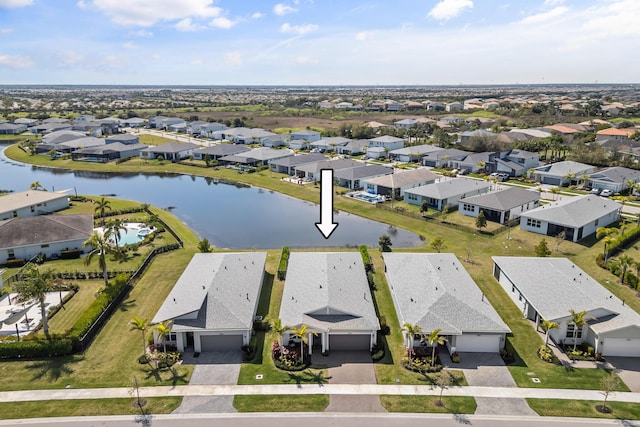 aerial view with a residential view and a water view