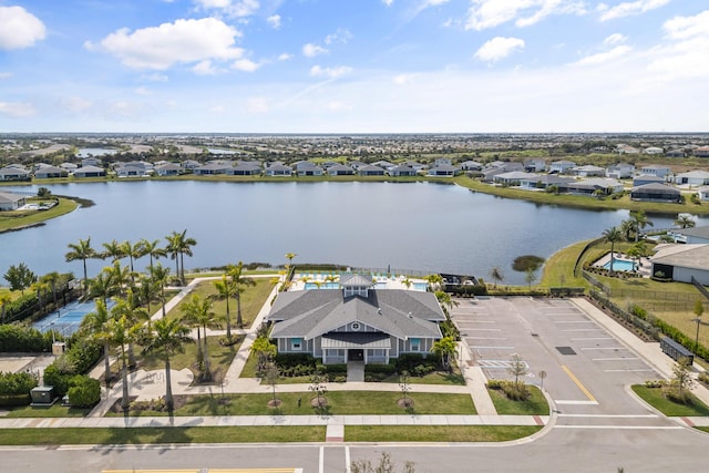 birds eye view of property with a residential view and a water view