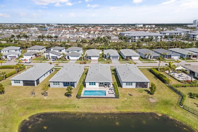 birds eye view of property featuring a water view and a residential view