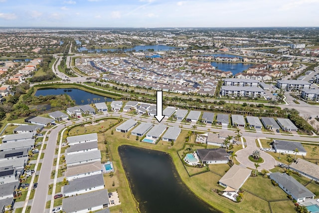 bird's eye view with a residential view and a water view