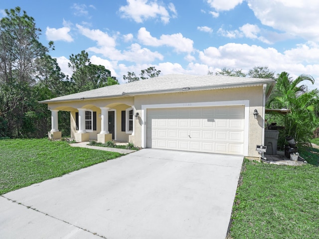 single story home with an attached garage, a shingled roof, concrete driveway, stucco siding, and a front lawn