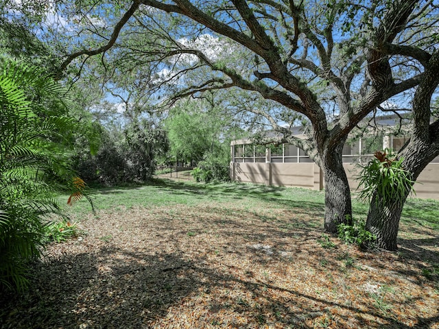 view of yard featuring a sunroom