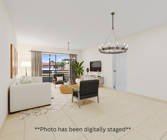 living area featuring baseboards, light tile patterned floors, and a notable chandelier