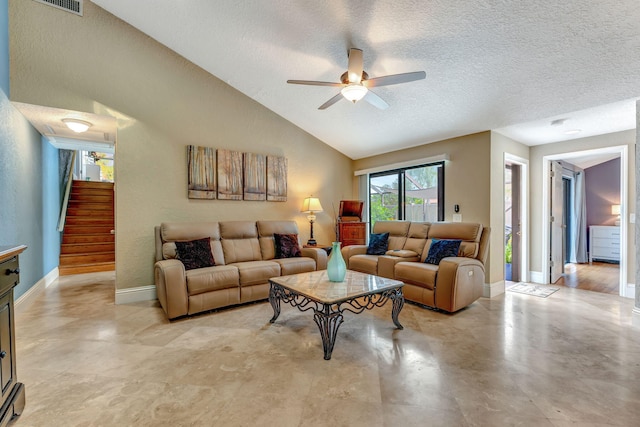 living area with lofted ceiling, a ceiling fan, a textured ceiling, baseboards, and stairs