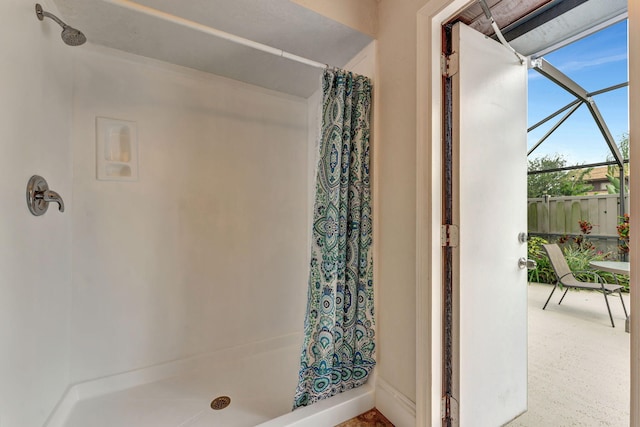 bathroom featuring a shower with curtain