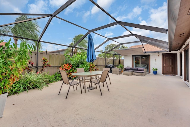 view of patio / terrace featuring a lanai, outdoor dining area, a fenced backyard, and an outdoor living space