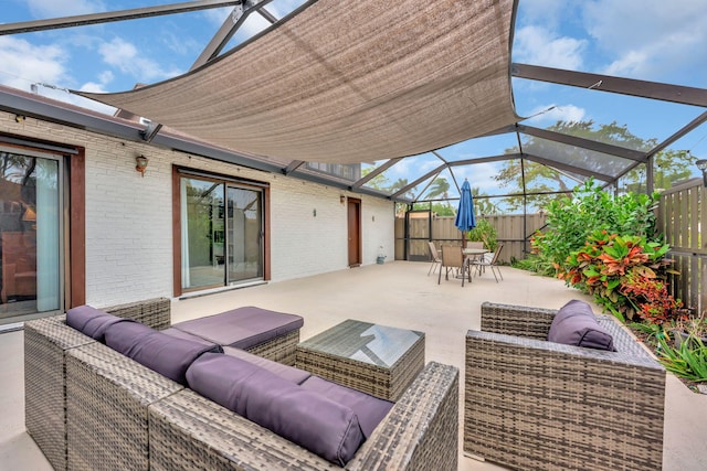 view of patio / terrace featuring a fenced backyard, an outdoor hangout area, outdoor dining area, and glass enclosure