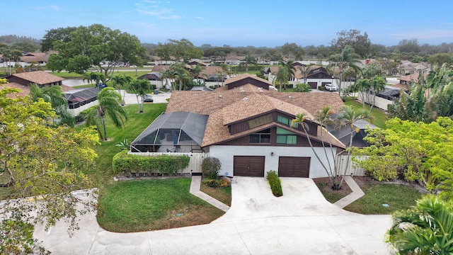 birds eye view of property with a residential view