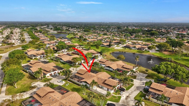 aerial view with a water view and a residential view