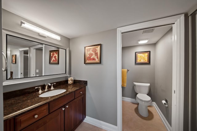 bathroom with visible vents, baseboards, toilet, tile patterned floors, and vanity