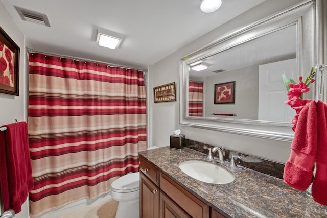 full bathroom featuring visible vents, curtained shower, toilet, and vanity