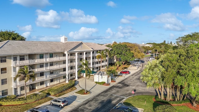 view of property with uncovered parking