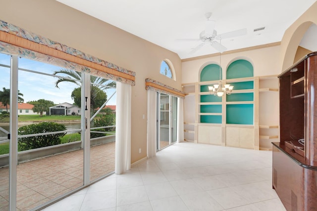 sunroom / solarium with visible vents and ceiling fan with notable chandelier