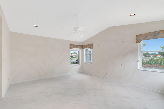 empty room with lofted ceiling, ceiling fan, baseboards, and recessed lighting