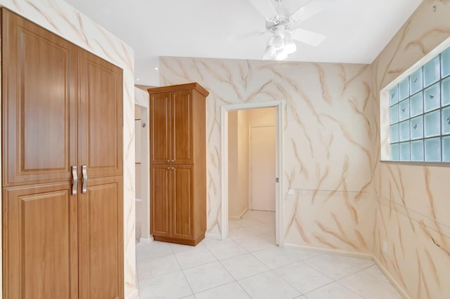 corridor featuring light tile patterned floors