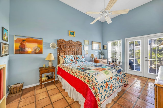 tiled bedroom with baseboards, ceiling fan, access to exterior, a high ceiling, and french doors