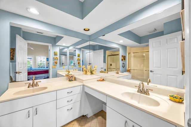 bathroom featuring ensuite bathroom, recessed lighting, vanity, a shower stall, and tile patterned floors