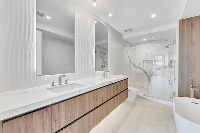 bathroom with visible vents, a sink, a marble finish shower, and double vanity