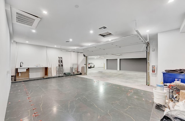 garage with visible vents and a sink