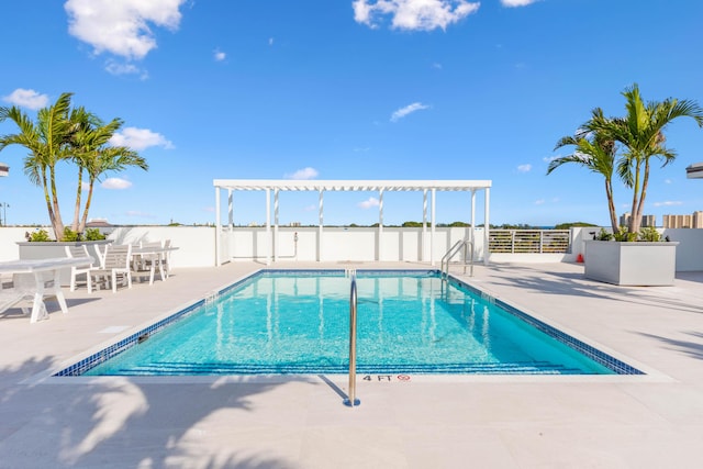 community pool featuring a patio area, fence, and a pergola