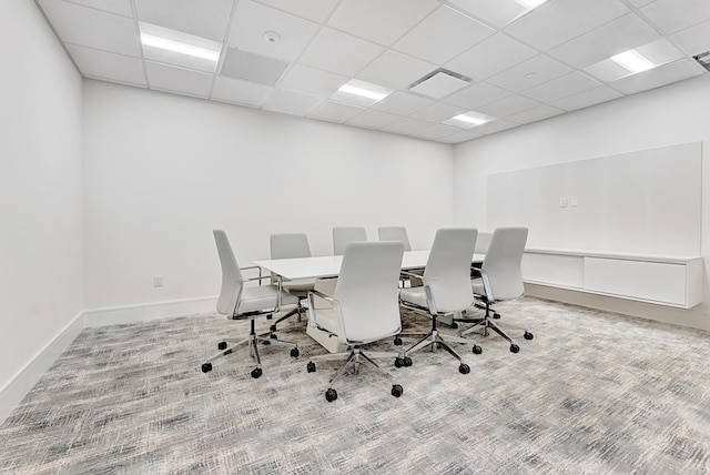 carpeted home office with a paneled ceiling, visible vents, and baseboards