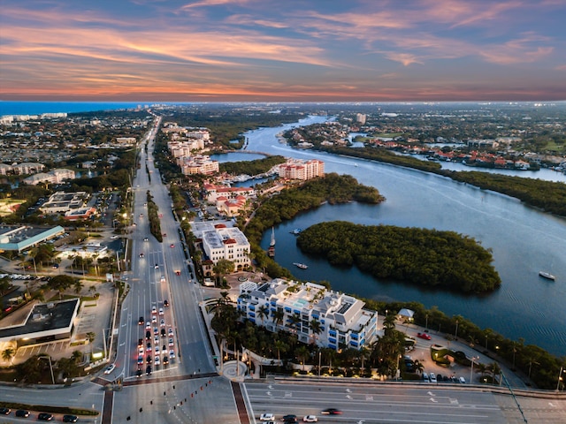 aerial view at dusk with a water view