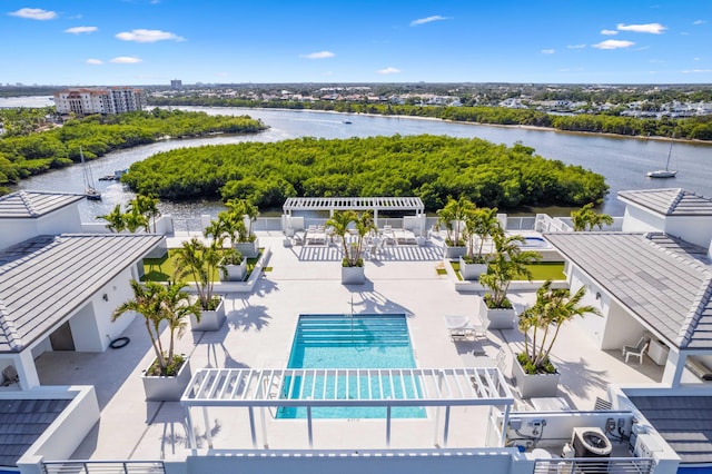 birds eye view of property with a water view