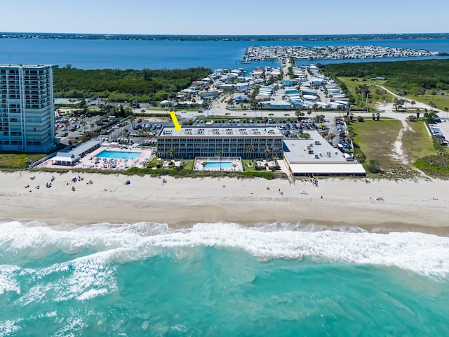 aerial view featuring a view of the beach and a water view