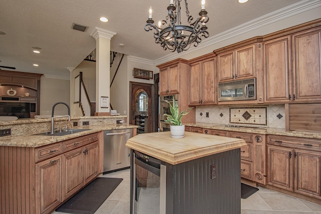 kitchen with visible vents, appliances with stainless steel finishes, a sink, butcher block countertops, and wine cooler