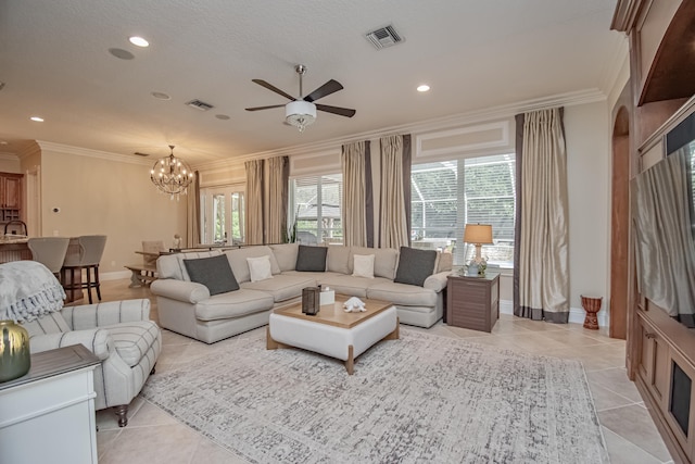 living area with crown molding, ceiling fan with notable chandelier, and a healthy amount of sunlight