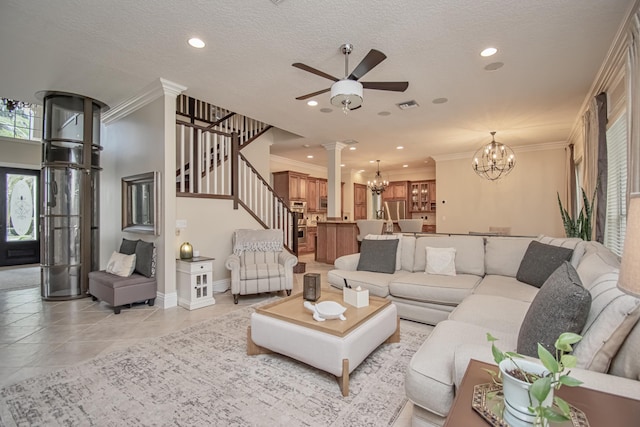 living area featuring crown molding, visible vents, stairs, and ceiling fan with notable chandelier