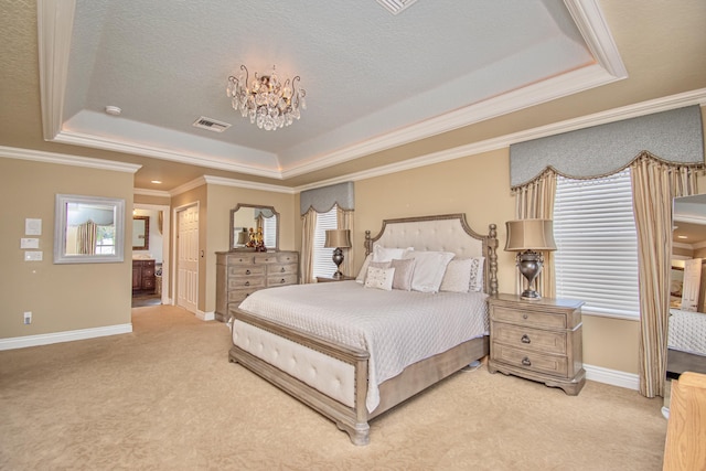 bedroom with carpet floors, a raised ceiling, and a chandelier
