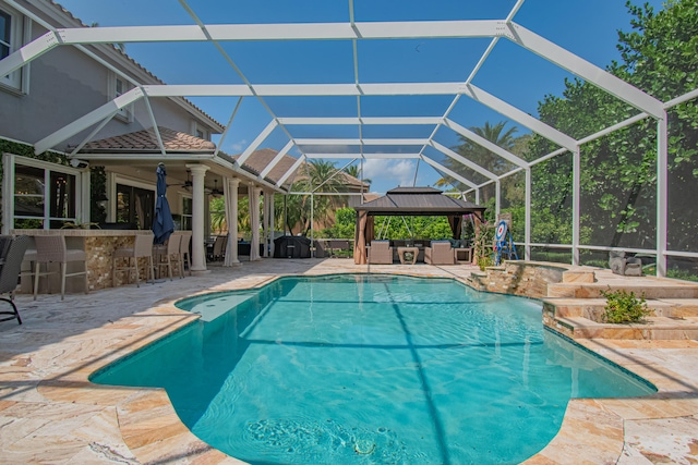 pool with a patio area, an outdoor living space, outdoor dry bar, and a lanai
