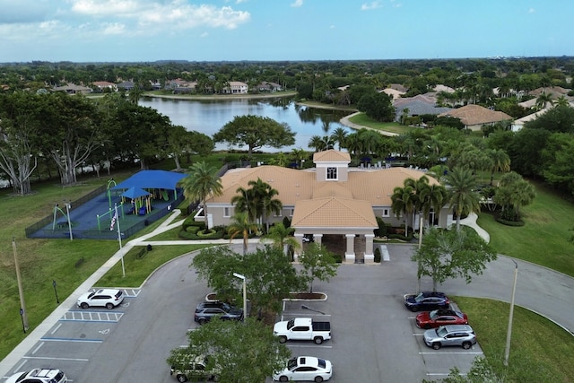 birds eye view of property with a water view