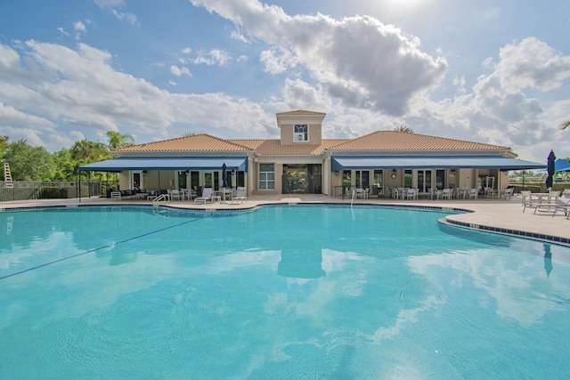 pool featuring a patio and fence