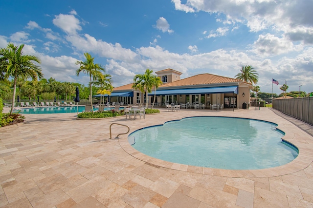 pool featuring a patio and fence